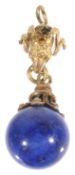 A small Etruscan style ram's head lapis drop pendant