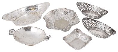 A collection of Edwardian and George V silver pierced trinket dishes, baskets