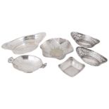 A collection of Edwardian and George V silver pierced trinket dishes, baskets