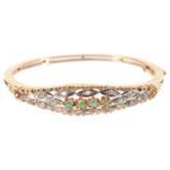 A Continental 18K gold emerald and diamond hinged bangle