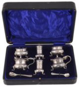 A cased Edwardian silver cruet suite, hallmarked Chester 1910