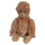 A miniature Schuco monkey compact, early 20th century