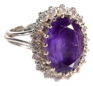 A Continental white gold coloured metal amethyst and diamond dress ring