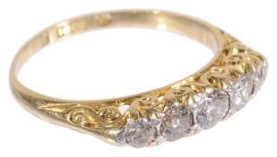 A five stone diamond set half hoop ring