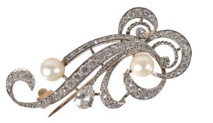 An attractive early 20th century diamond and pearl scroll brooch