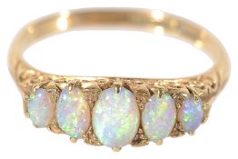 A delicate 19th century 18ct gold five stone opal ring