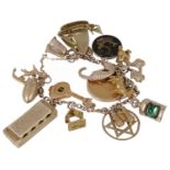 A 9ct gold and yellow metal charm bracelet hung with a variety of interesting charms
