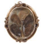 A Victorian yellow metal oval memorial picture brooch