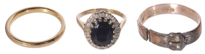 A dark sapphire and diamond cluster ring