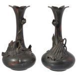 A pair of Japanese Meji period spelter floral trumpet shaped vases
