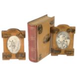 Two Mauchline ware photo frames and a Mauchline ware bound photograph album, each showing scenes of