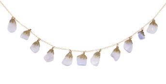 A delicate lilac stone drop necklace