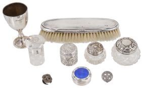 A collection of Edwardian and later silver dressing table bottles, brush, egg cup and trinket boxes