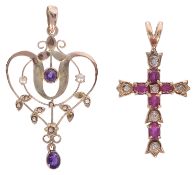 An Art Nouveau foliate scroll pendant together with a ruby and diamond set cross pendant