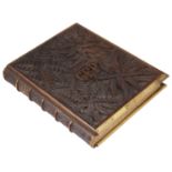 A heavily carved wooden and brass bound book by Richard Pigot entitled 'The Life of Man symbolised b