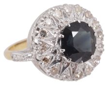 A large circular sapphire and diamond set dress ring