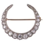 A Victorian white sapphire set crescent brooch