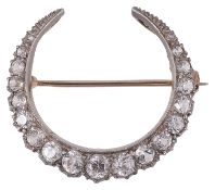 A Victorian white sapphire set crescent brooch