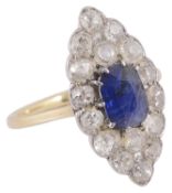 An Edwardian sapphire and diamond set marquis shaped ring