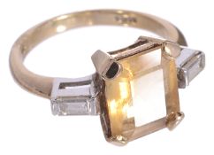 An attractive citrine and baguette diamond set dress ring