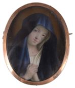 A yellow metal mounted portrait miniature brooch of the Maddona
