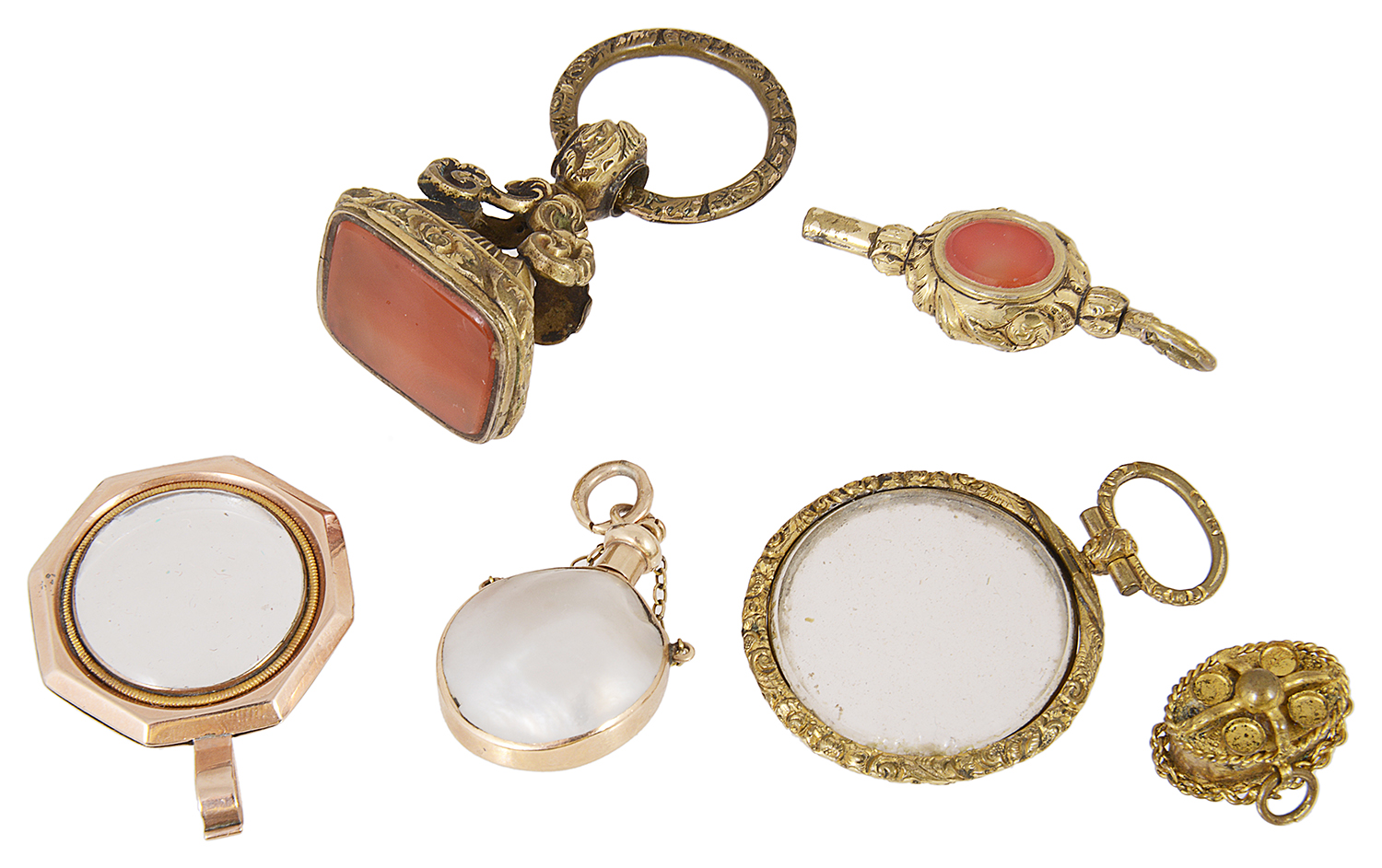 A Georgian magnifying locket, various hard stone seals and other items