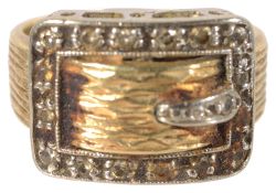 A Continental 18K gold and diamond set buckle ring