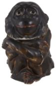 A 20th century hard paste porcelain tobacco jar in the form of a monkey