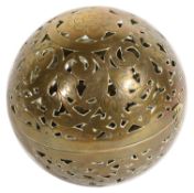 A pierced brass hand warmer, possibly Persian