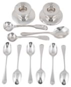 A pair of silver candlestick, silver teaspoons, condiment spoons