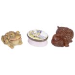Two decorative figures of a frog and a cat together with an oval enamel hinged lidded patch box, a/f