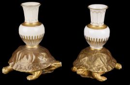 A pair of Royal Worcester aesthetic period tortoise candlesticks(2)