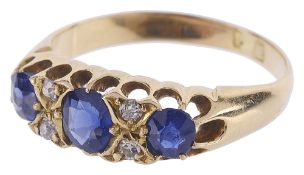 A three stone sapphire set gypsy ring