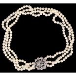 Continental cultured pearl necklace with ruby and diamond set clasp