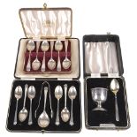 George V and later silver teaspoons and christening suite(3 cases)