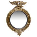 A Regency style giltwood convex circular wall mirror