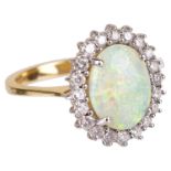 A Continental opal and diamond set cluster ring