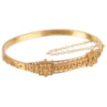 An 18ct gold Vict. Etruscan style hinged bangle