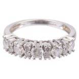 A white gold mounted diamond set half eternity ring