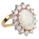 A large opal and diamond cluster ring