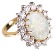 A large opal and diamond cluster ring