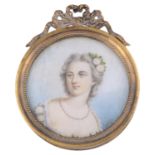 A 19th c. ivory portrait miniature of a young girl