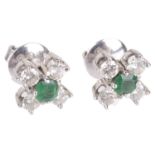 A pair of Continental emerald and diamond set earrings