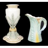 A Royal Worcester vase with triple bird claw support(2)