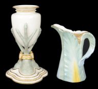 A Royal Worcester vase with triple bird claw support(2)