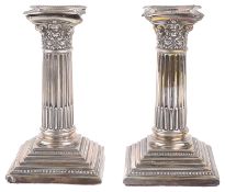 A pair of Edwardian silver dwarf candlestick, Sheffield 1909 (2)