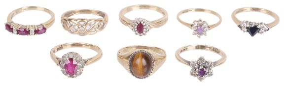 A collection of eight gold mounted gem set dress rings