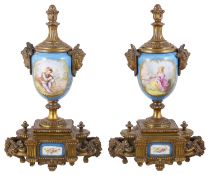 A pair of Sevres style porcelain and gilt metal urns(2)