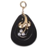 An unusual black spiral pendant with pearl motif