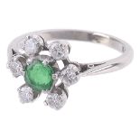 An emerald and diamond set open cluster ring
